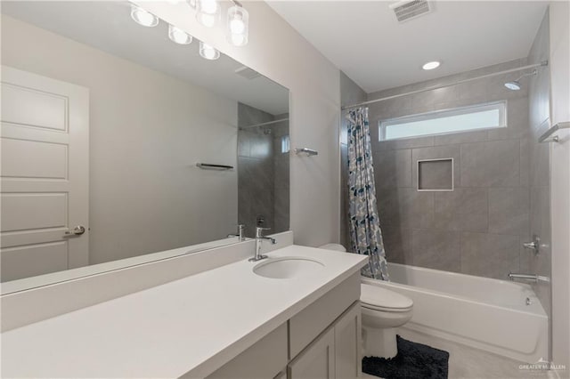 full bathroom featuring shower / bathtub combination with curtain, vanity, and toilet