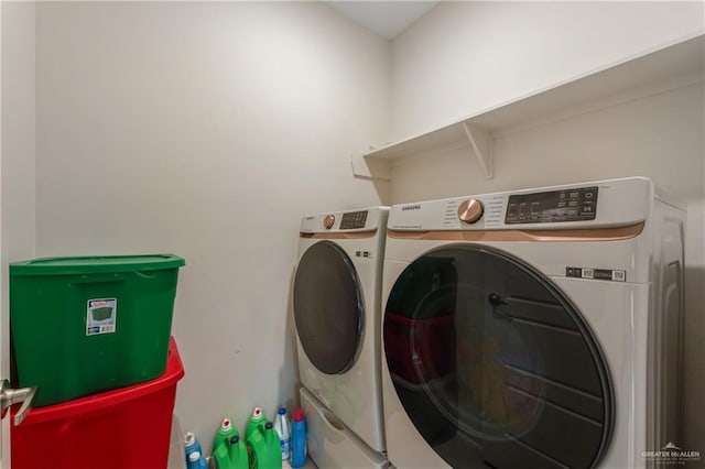 washroom featuring washer and dryer