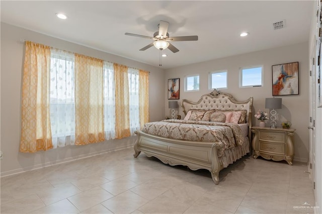 tiled bedroom with ceiling fan