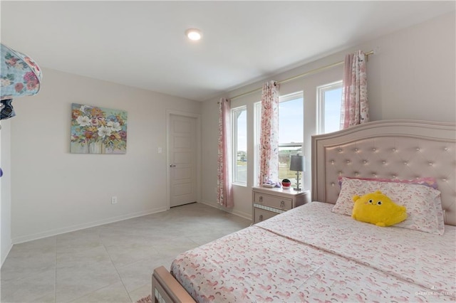 bedroom with light tile patterned floors