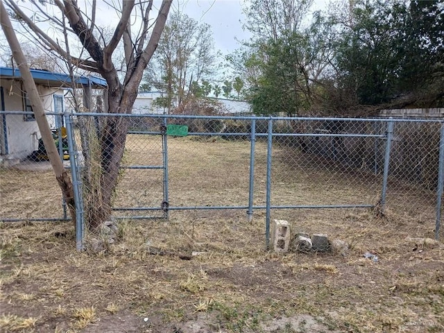 view of gate with fence