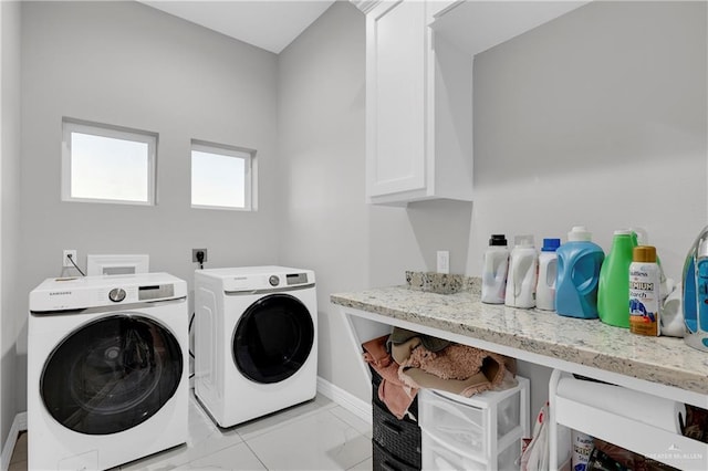 washroom with cabinets and independent washer and dryer