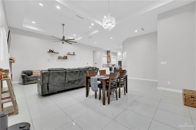 dining area with ceiling fan with notable chandelier