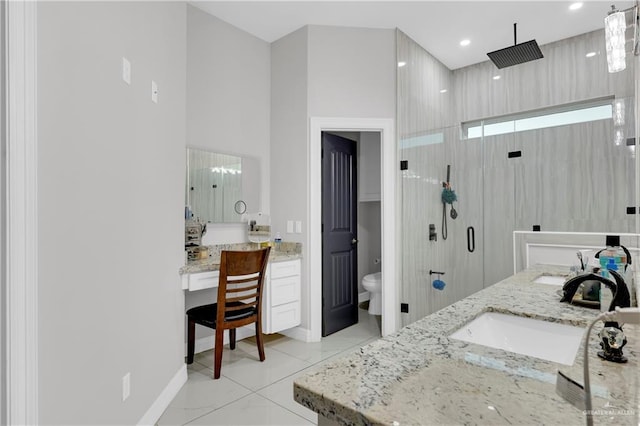 bathroom with tile patterned floors, toilet, a shower, and vanity