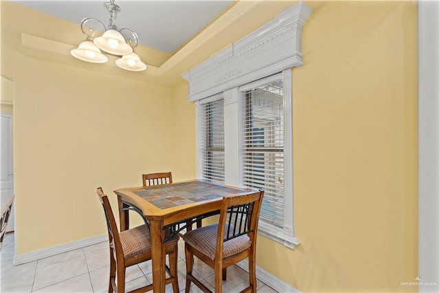 1800 E 24th St, Mission, TX 78574 - dining room featuring baseboards, a notable chandelier, and light tile patterned floors