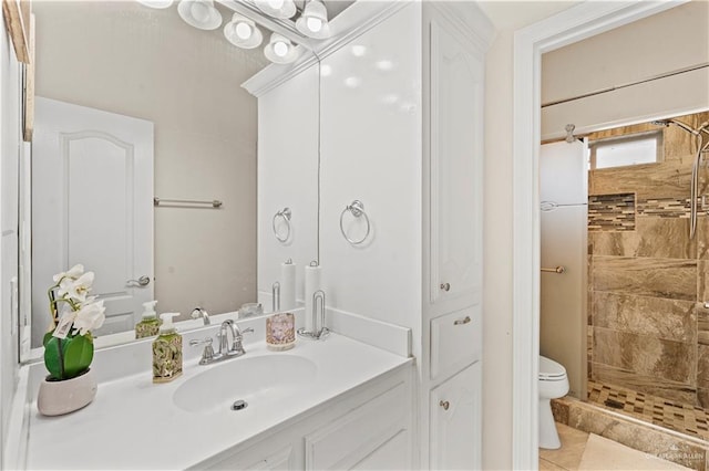1800 E 24th St, Mission, TX 78574 - bathroom featuring toilet, tile patterned floors, a tile shower, and vanity