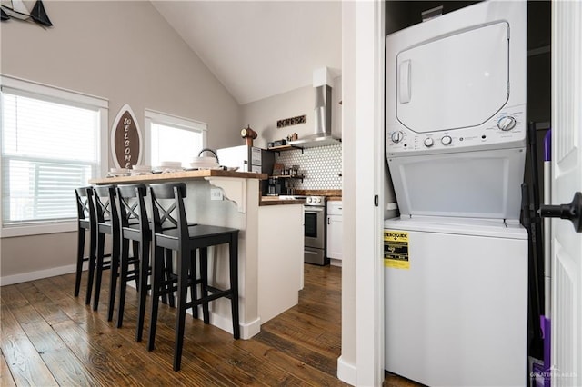 1053 Johnson Rd, Santa Fe, TX 77617 - clothes washing area featuring stacked washer / dryer and dark wood-style floors