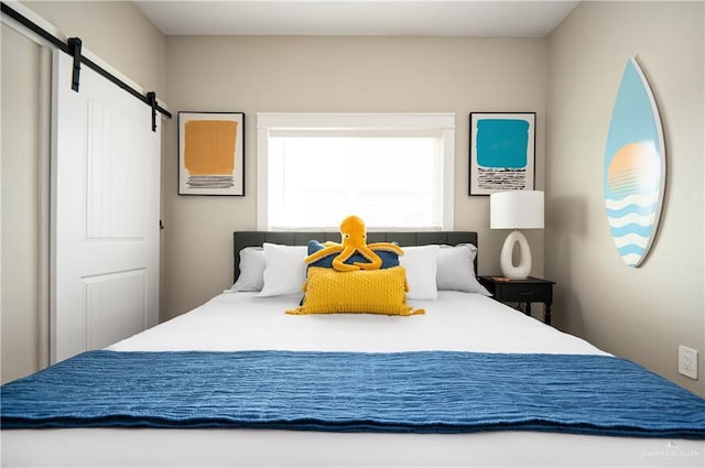 1053 Johnson Rd, Santa Fe, TX 77617 - bedroom with a barn door