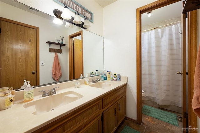 2403 Silver Oak Ave, Mission, TX 78574 - bathroom with double vanity, visible vents, toilet, and a sink