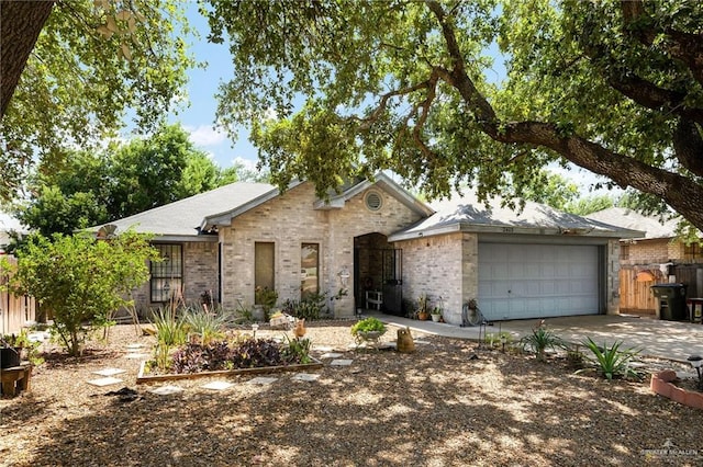 2403 Silver Oak Ave, Mission, TX 78574 - single story home with brick siding, an attached garage, concrete driveway, and fence