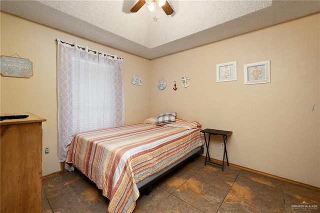 2403 Silver Oak Ave, Mission, TX 78574 - bedroom featuring stone finish floor, baseboards, and ceiling fan