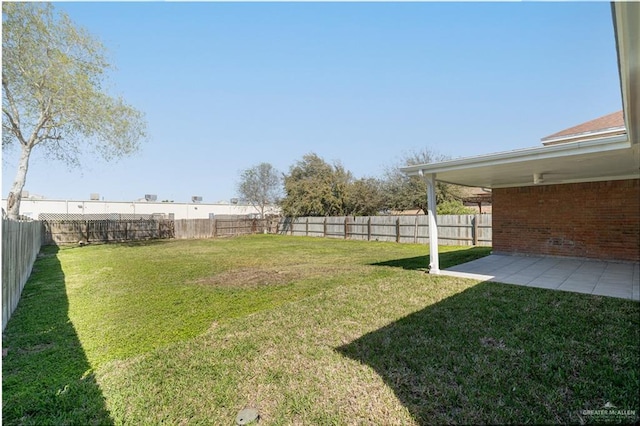 view of yard with a patio area and a fenced backyard