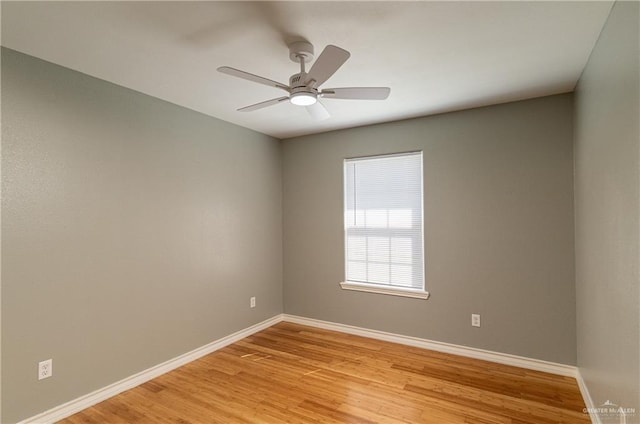 unfurnished room with light wood finished floors, ceiling fan, and baseboards