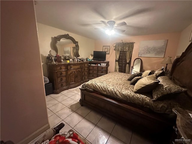 tiled bedroom with ceiling fan