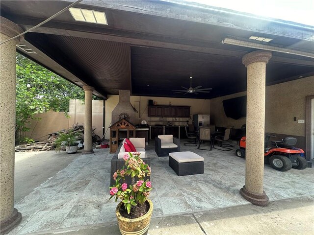 view of patio / terrace featuring ceiling fan