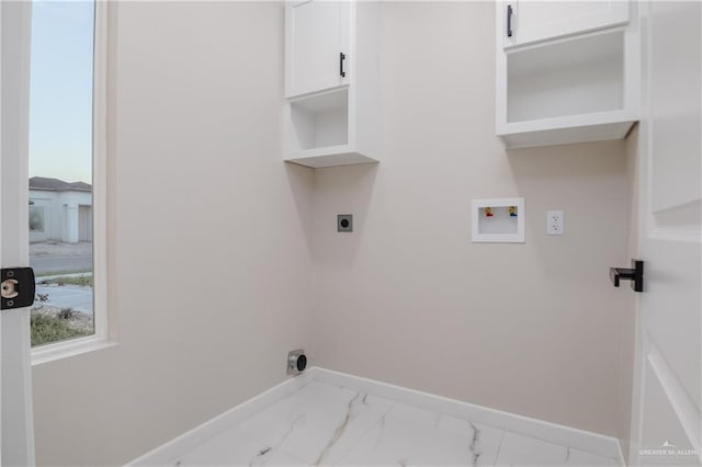 washroom featuring washer hookup, baseboards, marble finish floor, cabinet space, and electric dryer hookup