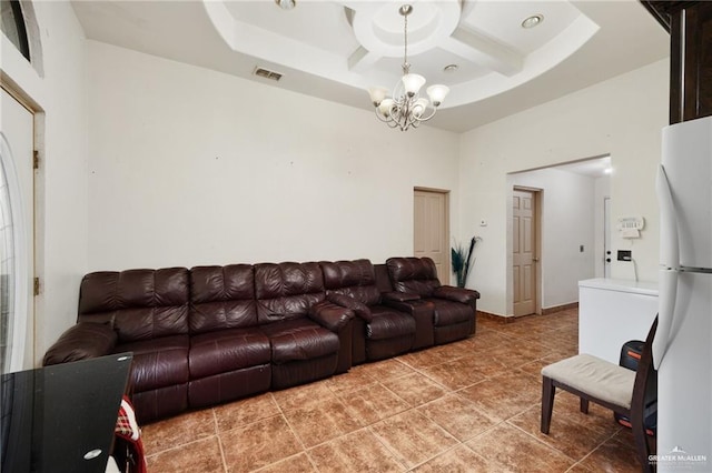 living room with tile patterned floors, a tray ceiling, a towering ceiling, and a notable chandelier