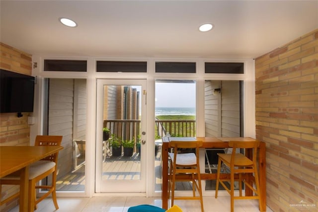 dining area with brick wall