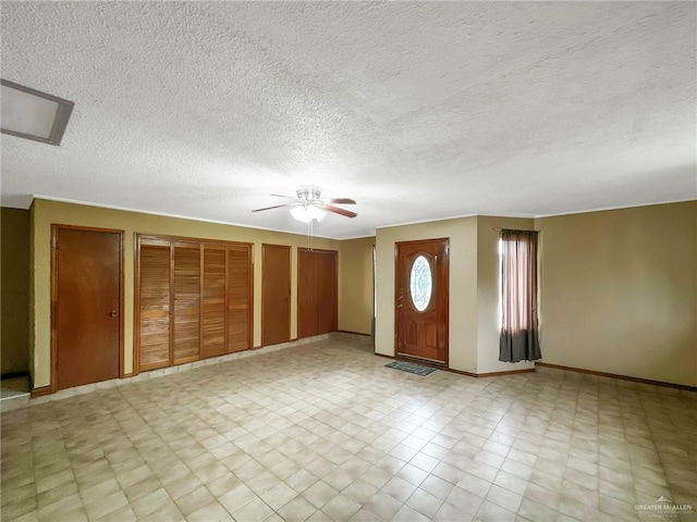 2417 W Iris Ave, Mcallen, TX 78501 - foyer with a ceiling fan, a textured ceiling, and baseboards