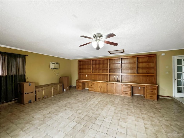 2417 W Iris Ave, Mcallen, TX 78501 - unfurnished living room with ceiling fan, a textured ceiling, and an AC wall unit