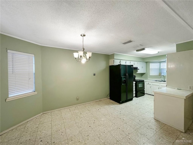 2417 W Iris Ave, Mcallen, TX 78501 - kitchen with black appliances, a sink, light countertops, a textured ceiling, and crown molding