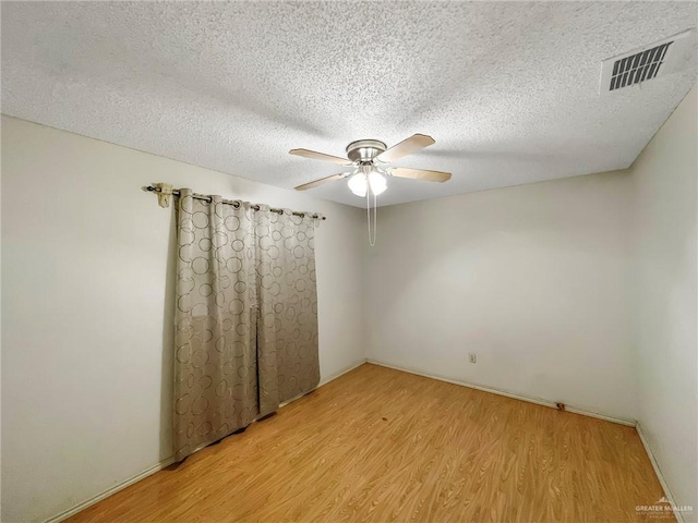 2417 W Iris Ave, Mcallen, TX 78501 - spare room with ceiling fan, light wood-style flooring, and a textured ceiling