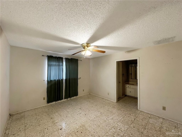 2417 W Iris Ave, Mcallen, TX 78501 - spare room featuring a ceiling fan, light floors, a textured ceiling, and baseboards