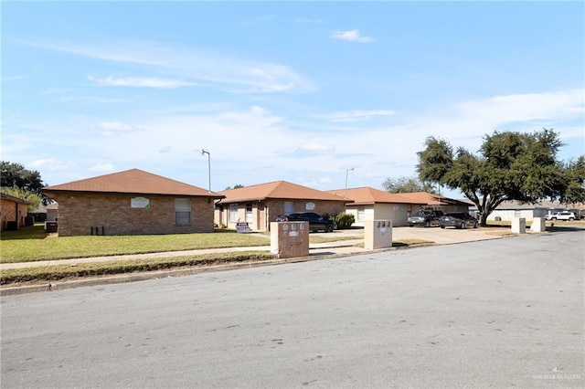 single story home with a front yard