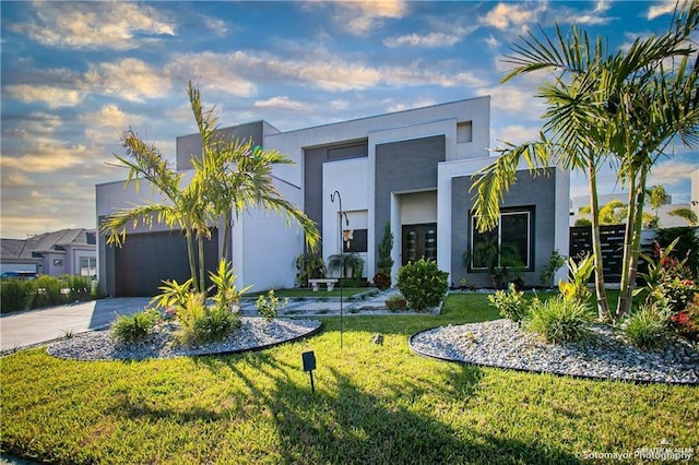 modern home featuring a front yard