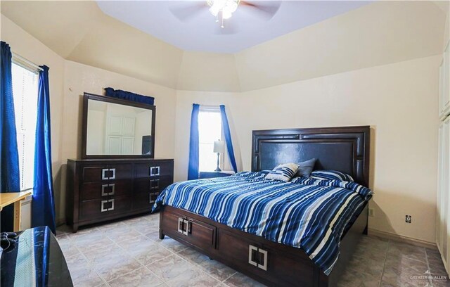 bedroom featuring ceiling fan and lofted ceiling