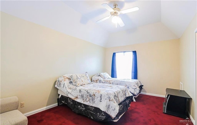 carpeted bedroom with vaulted ceiling and ceiling fan