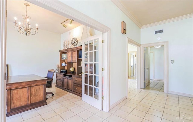 office with crown molding, light tile patterned floors, track lighting, and a notable chandelier