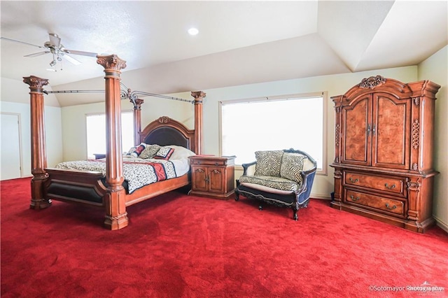 bedroom with carpet flooring, ceiling fan, and vaulted ceiling