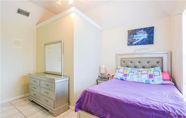 bedroom featuring light tile patterned flooring and lofted ceiling