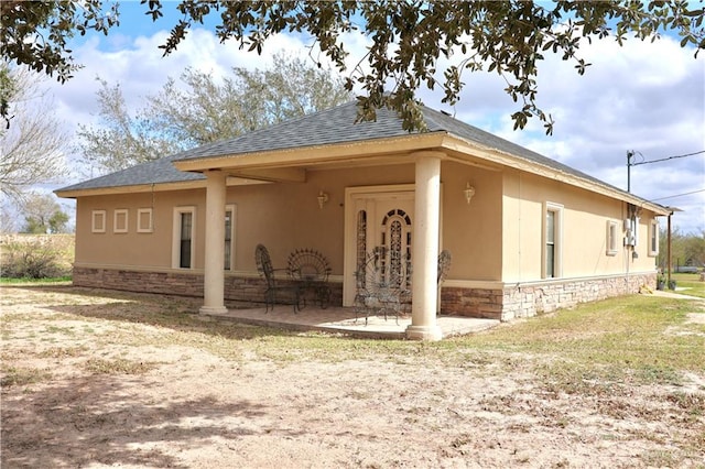 back of property featuring a patio