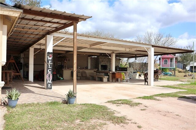 view of patio / terrace with a fireplace