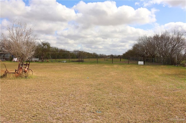 view of yard with a rural view