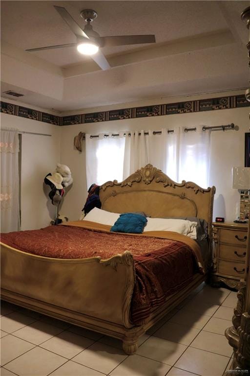 tiled bedroom featuring ceiling fan