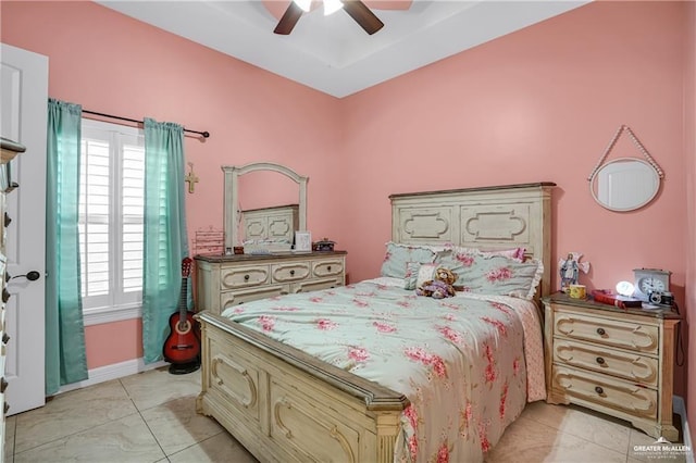 tiled bedroom with ceiling fan