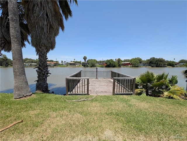 106 Resaca Shores Dr S, Los Fresnos, TX 78566 - dock featuring a yard and a water view