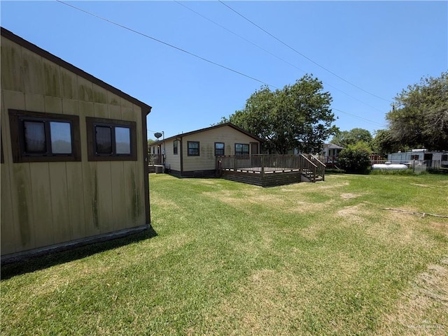 106 Resaca Shores Dr S, Los Fresnos, TX 78566 - view of green lawn with a wooden deck