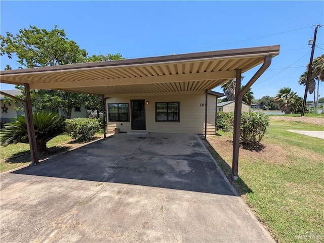 106 Resaca Shores Dr S, Los Fresnos, TX 78566 - view of patio with concrete driveway and a carport