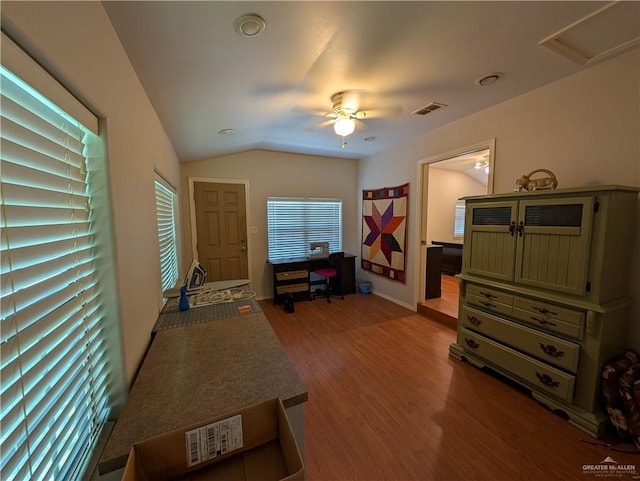 106 Resaca Shores Dr S, Los Fresnos, TX 78566 - living area featuring wood finished floors, ceiling fan, and vaulted ceiling