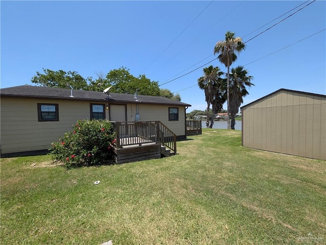 106 Resaca Shores Dr S, Los Fresnos, TX 78566 - view of green lawn with a deck with water view