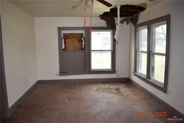 spare room featuring ceiling fan and hardwood / wood-style floors