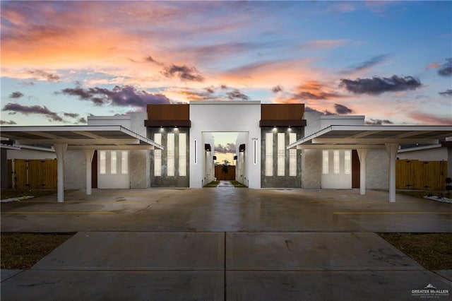 contemporary home featuring a carport