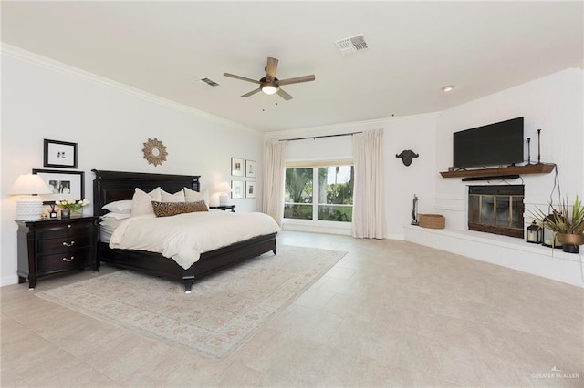 bedroom with ceiling fan and crown molding