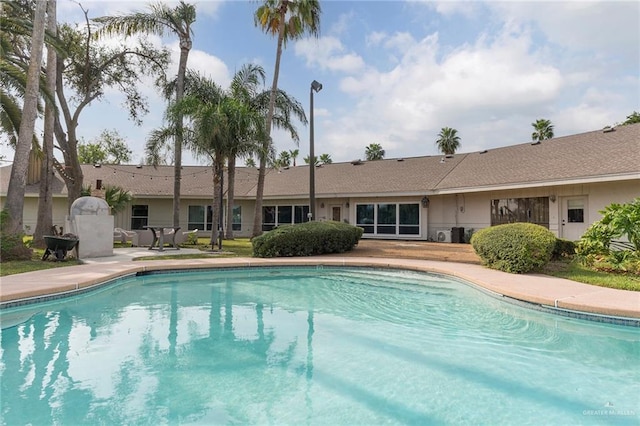 view of pool featuring a patio