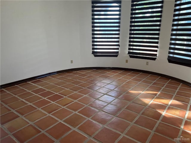 spare room with tile patterned flooring