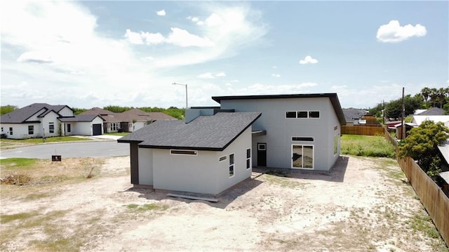 3724 E Diamondhead Ave, Alton, TX 78573 - back of house featuring a residential view and stucco siding